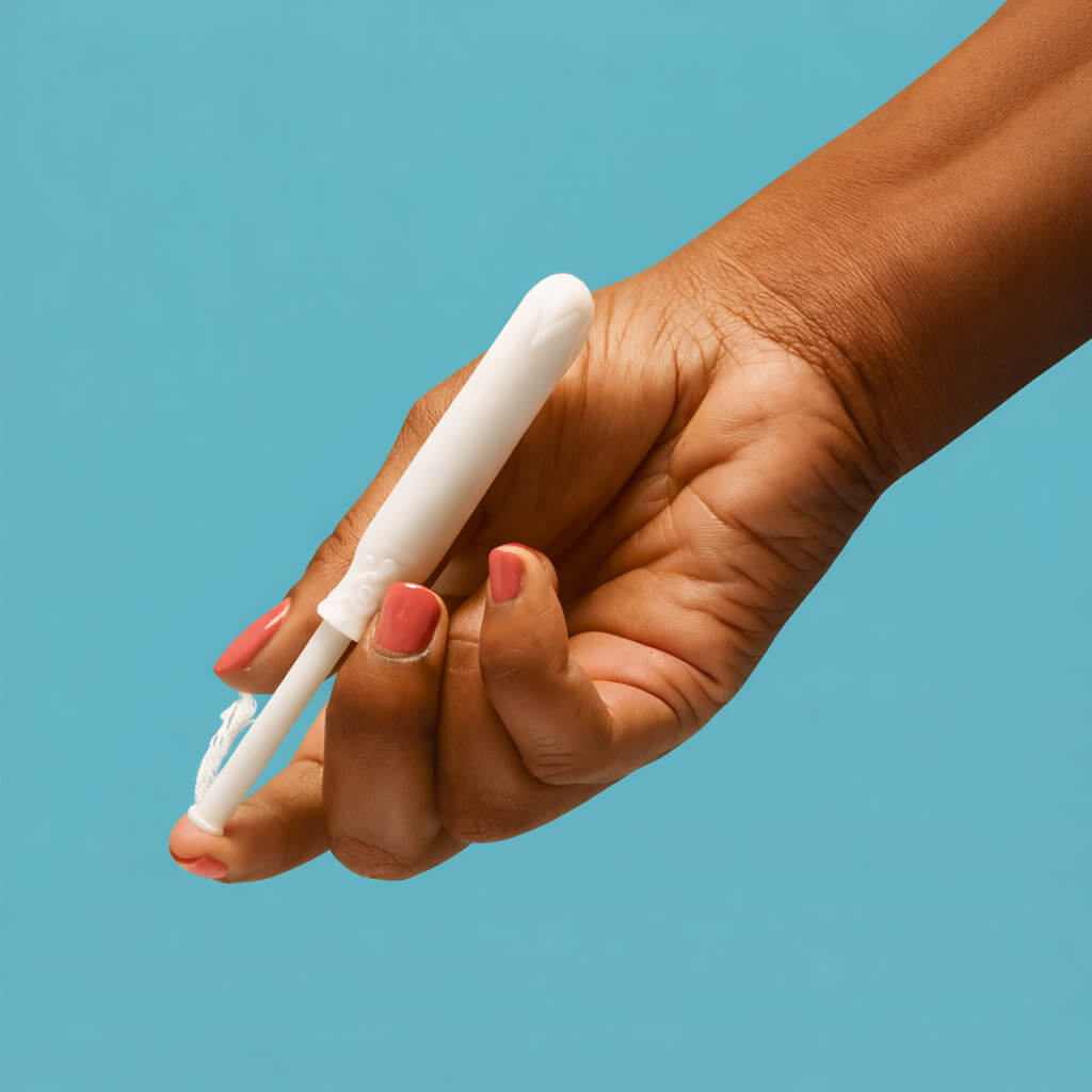 Hand holding a tampon